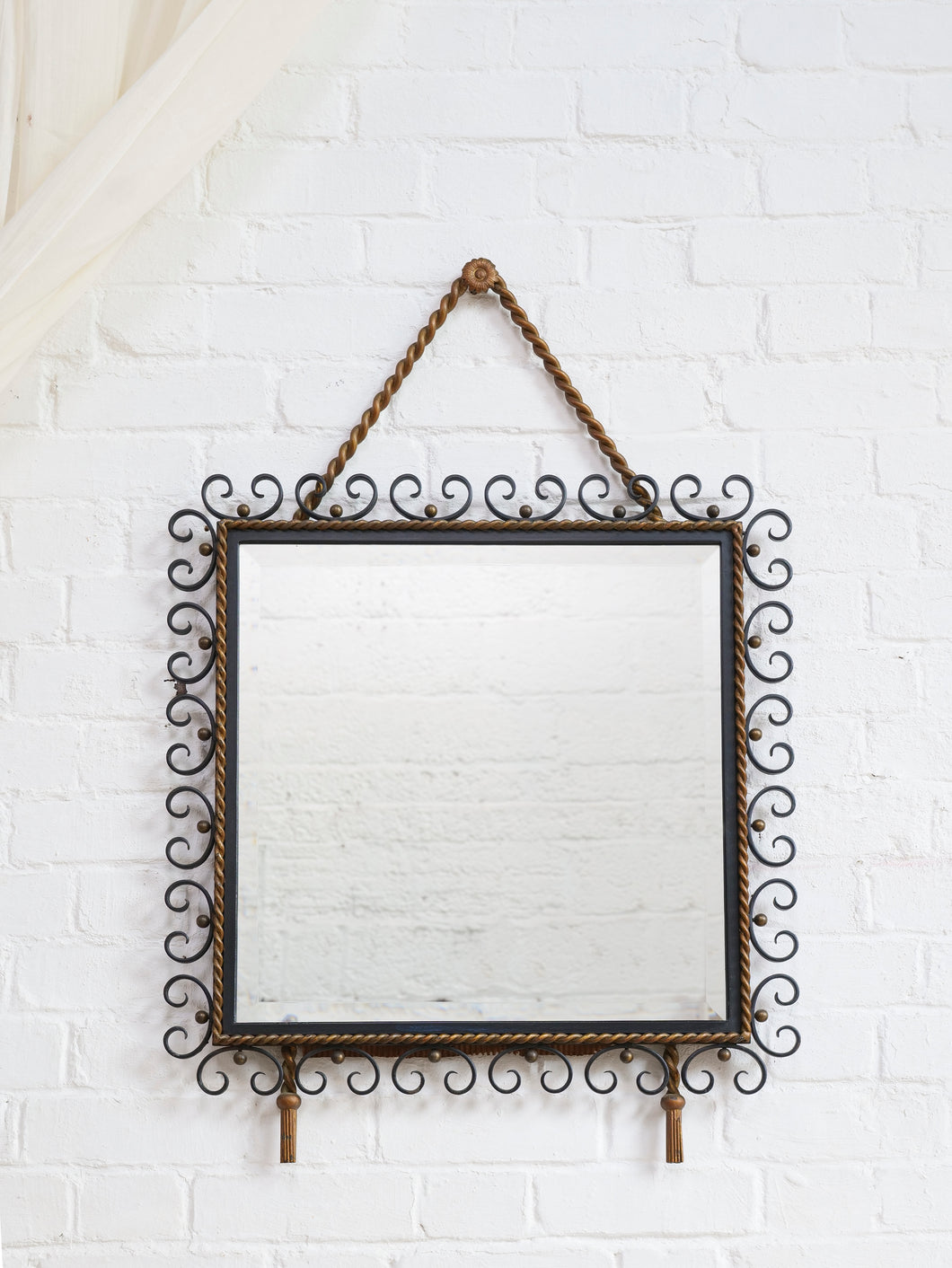Metal Scrollwork and Tassel Mirror