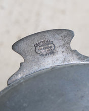 Load image into Gallery viewer, Close-up of the back of a vintage metal pot or pan handle, stamped with 'CRAFTSMAN MADE IN SURREY ENGLAND 1920' and 'HOWTER'.
