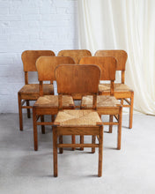 Load image into Gallery viewer, set of six art deco dining chairs in wood with rush seat pads ideal in a kitchen antique 
