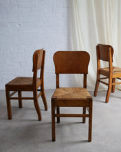 Load image into Gallery viewer, set of six art deco dining chairs in wood with rush seat pads ideal in a kitchen antique 
