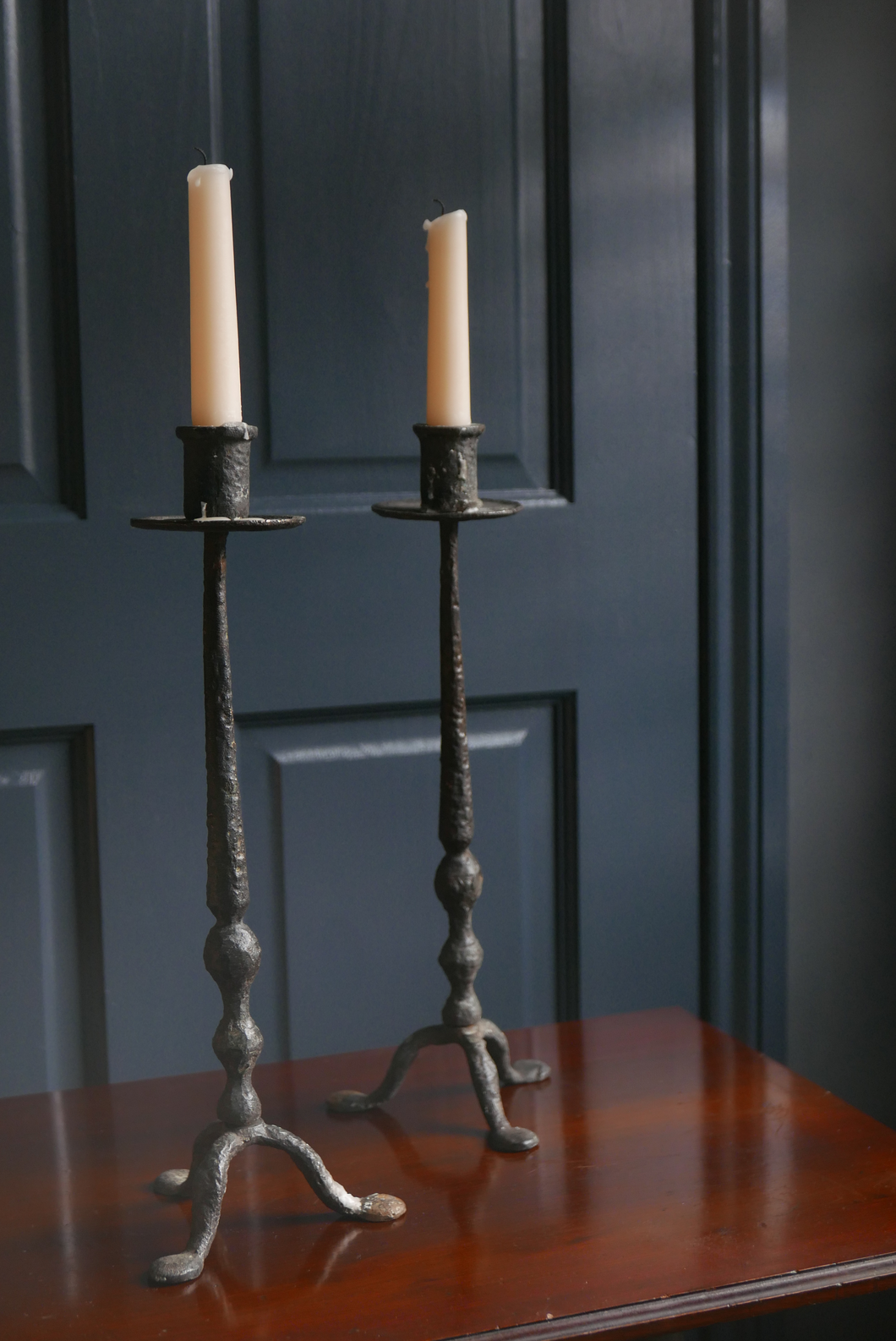 1970's midcentury wrought Iron brutalist style black candle sticks  with tapered bobbin steam 