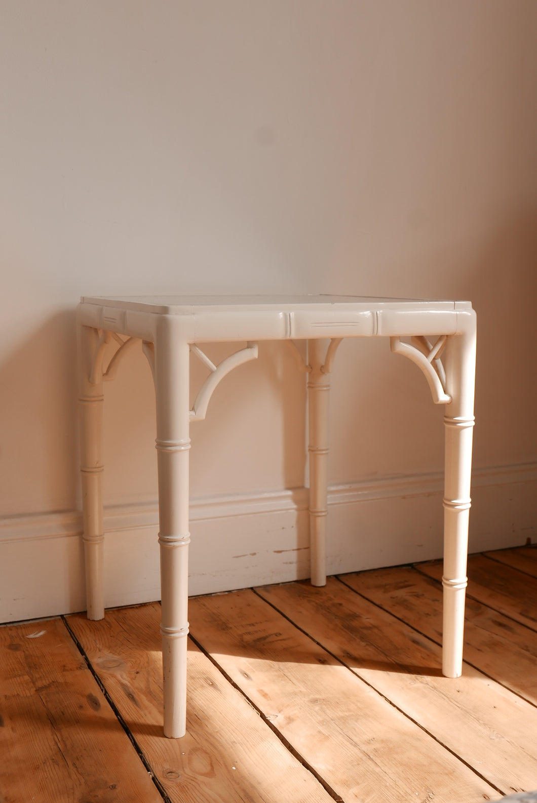 vintage white faux bamboo and cane side table / coffee table in the style of the chippindale models 