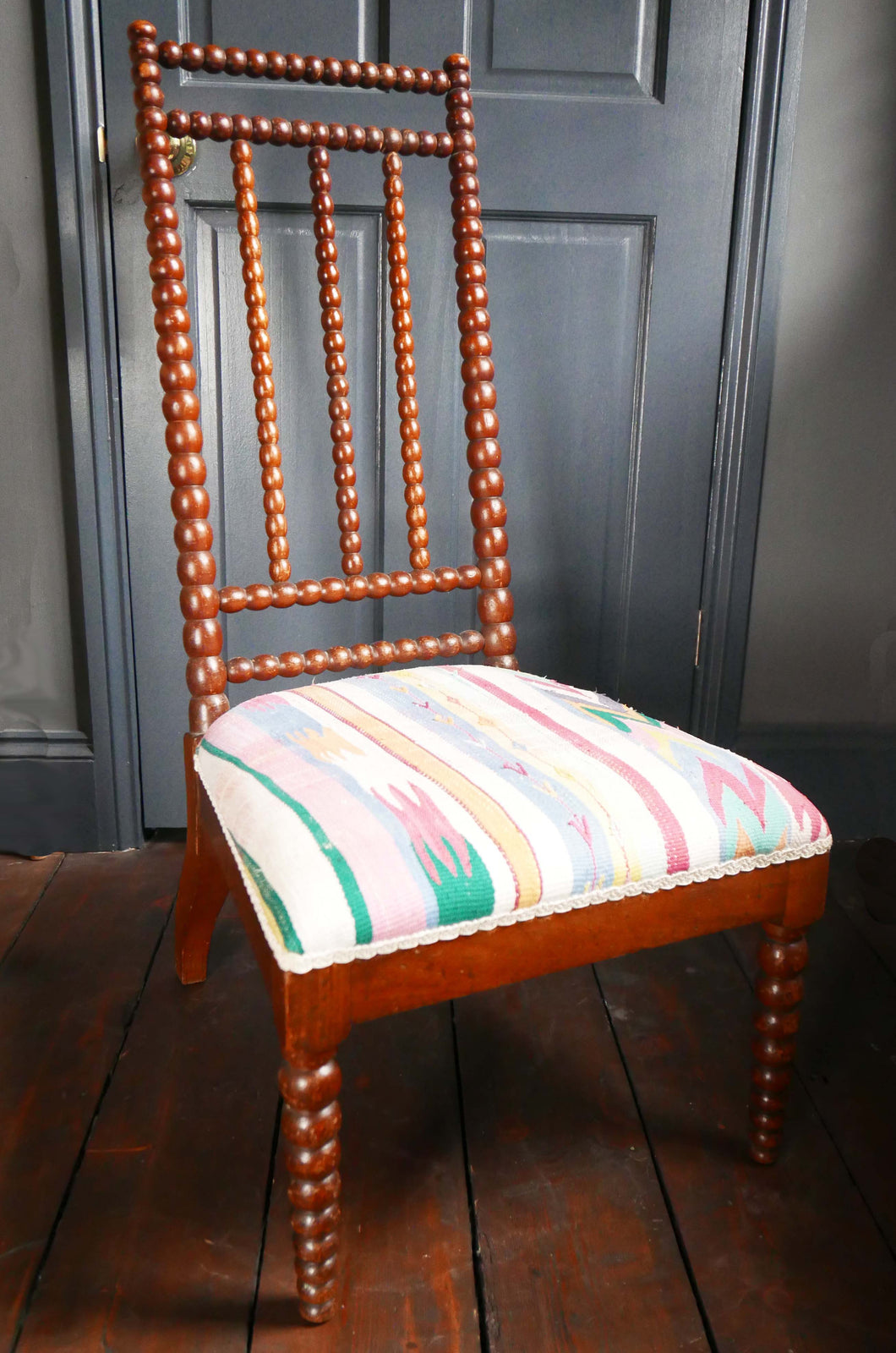 antique bobbin turned chair with padded seat 