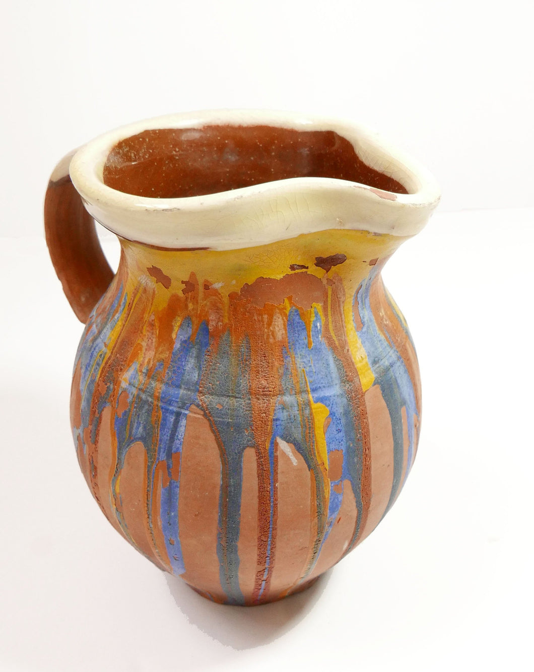 Vintage hand painted Jug with blue yellow and orange paint 